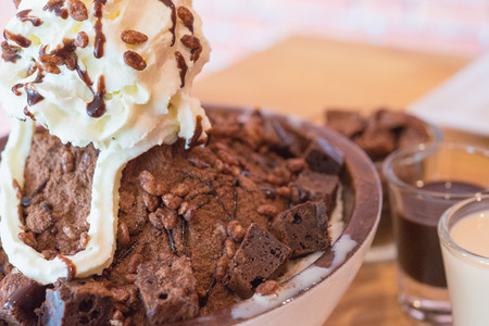 Korean style Chocolate brownie shaved ice serve with whipped cream and corn flake "Bingsu"の写真素材