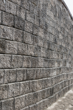 Old grungy gray brick wall texture, Stone wall backgroundの写真素材