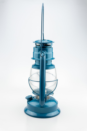 Paraffin lamp also commonly known as a Kerosene, Hurricane, Storm lamp isolated on a white background. blue kerosene lamp.の写真素材