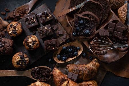 Pastry and bakery, desserts, cakes and cookies close-up on the dark background. の写真素材
