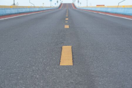 Landscape with road, sunny sky and beautiful asphalt road in the evening in summer.