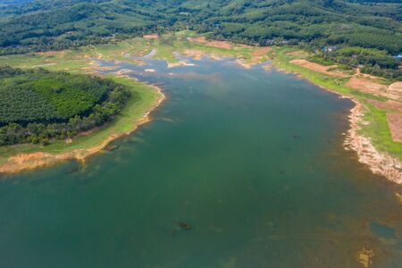 Dam Lake is located in Southern Thailand, lake serene with beautiful mountain background, Beautiful scenery of dam with mountain and lake view at Thailand, Asia.の写真素材