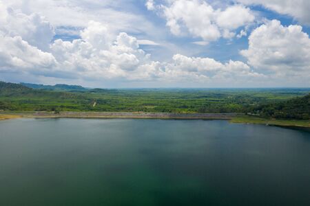 Dam Lake is located in Southern Thailand, lake serene with beautiful mountain background, Beautiful scenery of dam with mountain and lake view at Thailand, Asia.の写真素材