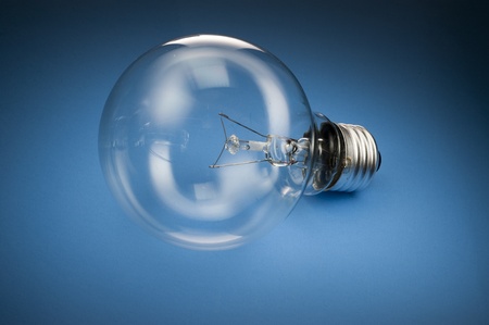 Light Bulb on blue backgroundの写真素材
