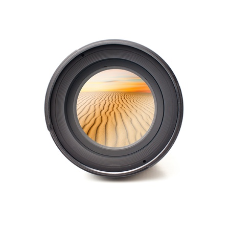 Front view of camera lens with desert landscape image reflectionの写真素材