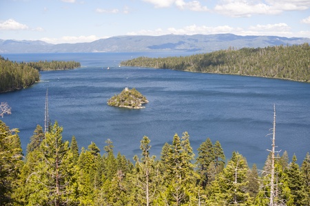 Emerald Bay with beautiful cloudy sky and green tree in the foreground, South Lake Tahoe, California, USAの写真素材
