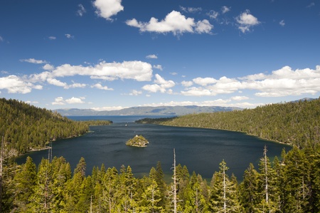Emerald Bay with beautiful cloudy sky and green tree in the foreground, South Lake Tahoe, California, USAの写真素材