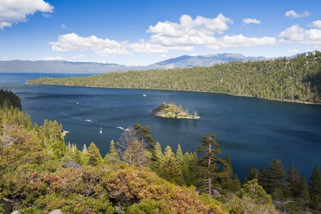 Emerald Bay with beautiful cloudy sky and green tree in the foreground, South Lake Tahoe, California, USAの写真素材