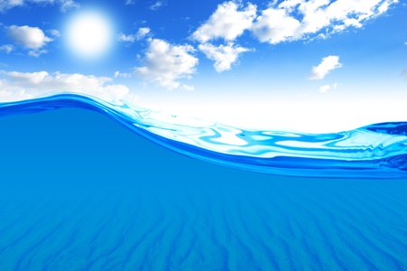 Ocean water with cloudy sky with sun in the backgroundの写真素材
