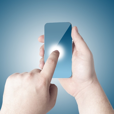Business man pointing on the touch screen mobile phoneの写真素材