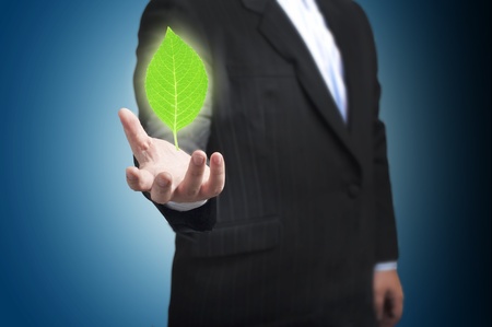 Business man with green plant  Concept for idea and GO greenの写真素材