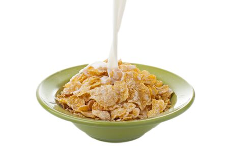 Breakfast Corn flakes with milk splashの写真素材