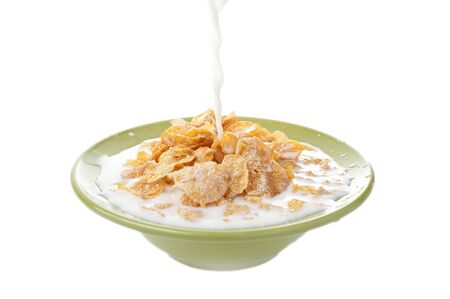 Breakfast Corn flakes with milk splashの写真素材