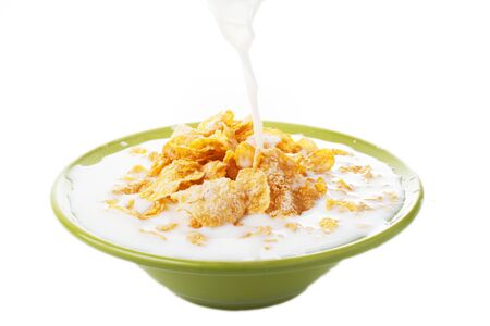 Breakfast Corn flakes with milk splashの写真素材