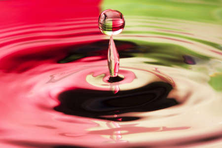 close up of a droplet of water with beautiful two tone colorの写真素材