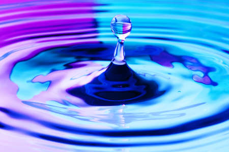 close up of a droplet of water with beautiful two tone color