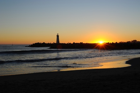 Windsurf and Silhouette Lighthouseの写真素材