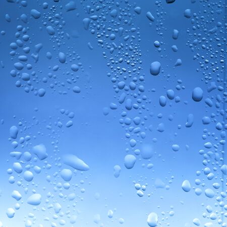 Water drop on bathroom windowの写真素材