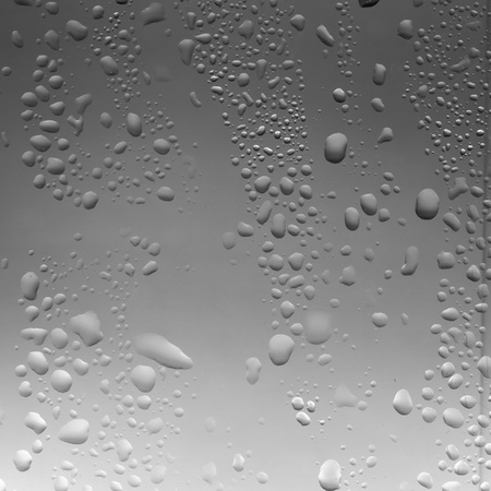 Water drop on bathroom windowの写真素材