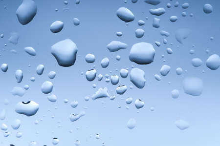 Water drop on bathroom windowの写真素材