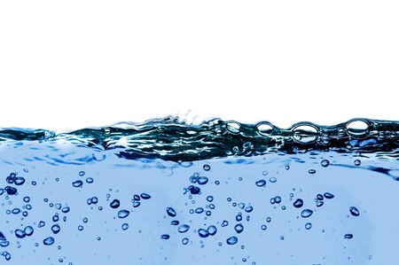Air bubbles in ocean water rise to the surfaceの写真素材