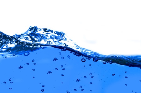 Air bubbles in ocean water rise to the surfaceの写真素材
