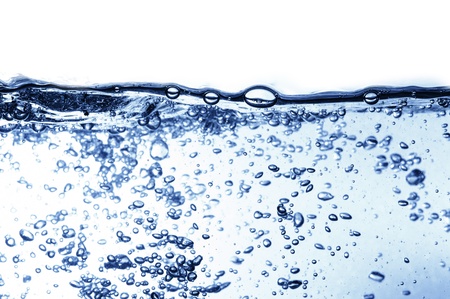 Air bubbles in ocean water rise to the surfaceの写真素材