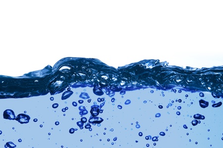 Air bubbles in ocean water rise to the surfaceの写真素材