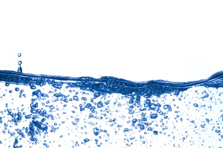Air bubbles in ocean water rise to the surfaceの写真素材