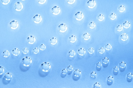 Water drop on blue backgroundの写真素材