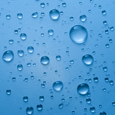 Water drop on blue backgroundの写真素材
