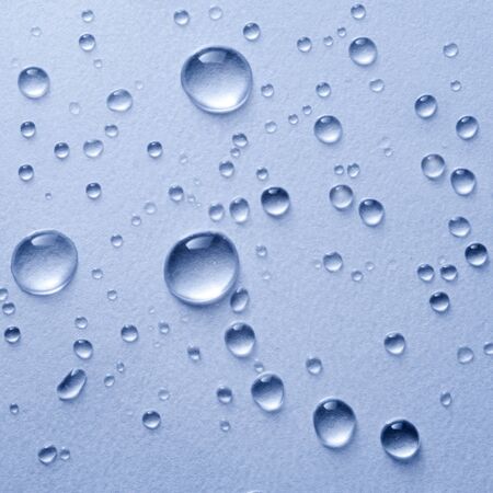 Water drop on blue backgroundの写真素材