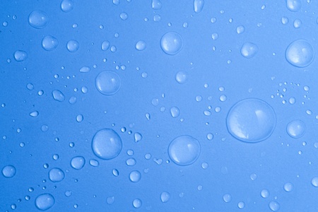 Water drop on blue backgroundの写真素材