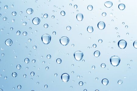  Water drop on blue backgroundの写真素材