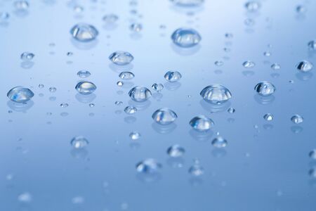  Water drop on blue backgroundの写真素材