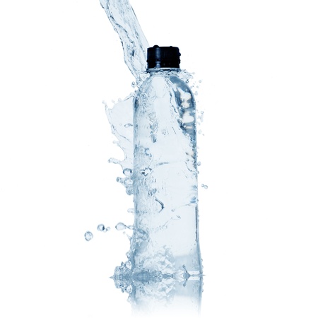 bottle of water and water splash isolated on whiteの写真素材