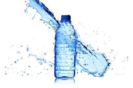 bottle of water and water splash isolated on whiteの写真素材