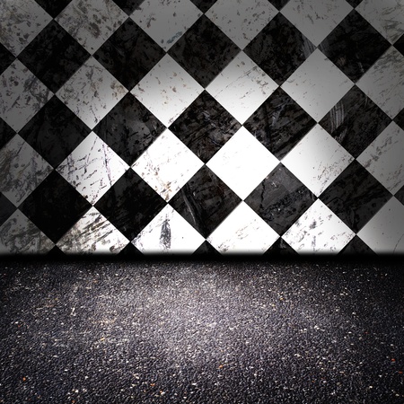 asphalt floor with checker wall in the backgroundの写真素材