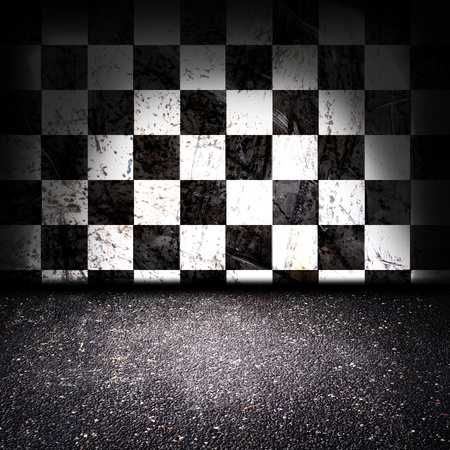 asphalt floor with checker wall in the backgroundの写真素材