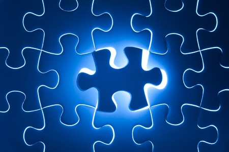 Missing Jigsaw puzzle in red color jigsaw  Business concept for completing team with key personの写真素材