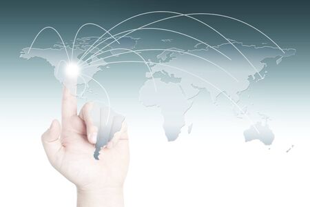 Business man clicking the touch screen for social network or business connection with world mapの写真素材