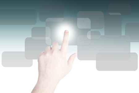 hand pushing on a touch screen on grey buttonの写真素材
