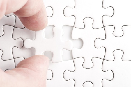Missing jigsaw puzzle piece with light glow, business concept for completing the final puzzle pieceの写真素材