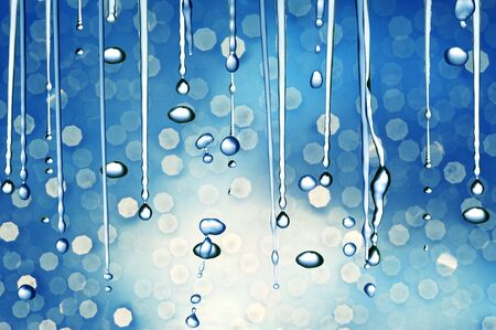 Water droplets on blue backdrop の写真素材