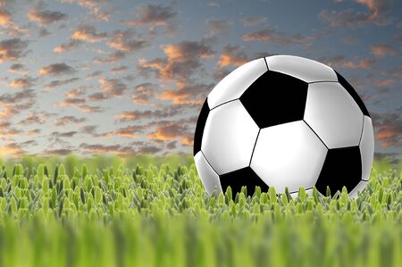 Soccer ball on sunset skyの写真素材