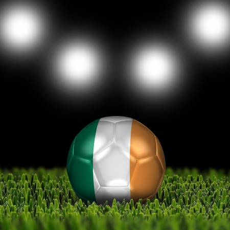 National Flag on the soccer ball on green grass with stadium lighting  Country Republic of Irelandの写真素材