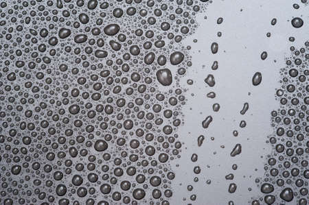Water drop on black backgroundの写真素材