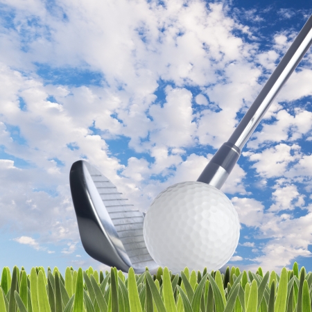 Golf ball and golf club on fresh green grassの写真素材