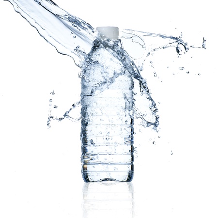 Water bottle and water splash isolated on whiteの写真素材