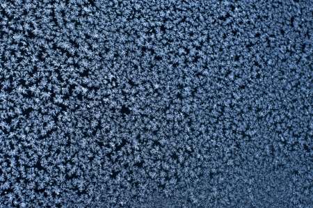 Ice on window at winter timeの写真素材